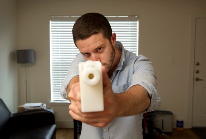 Cody Wilson shows off his first 3D-printed handgun, The Liberator, at his home in Austin, Texas, on May 10, 2013.