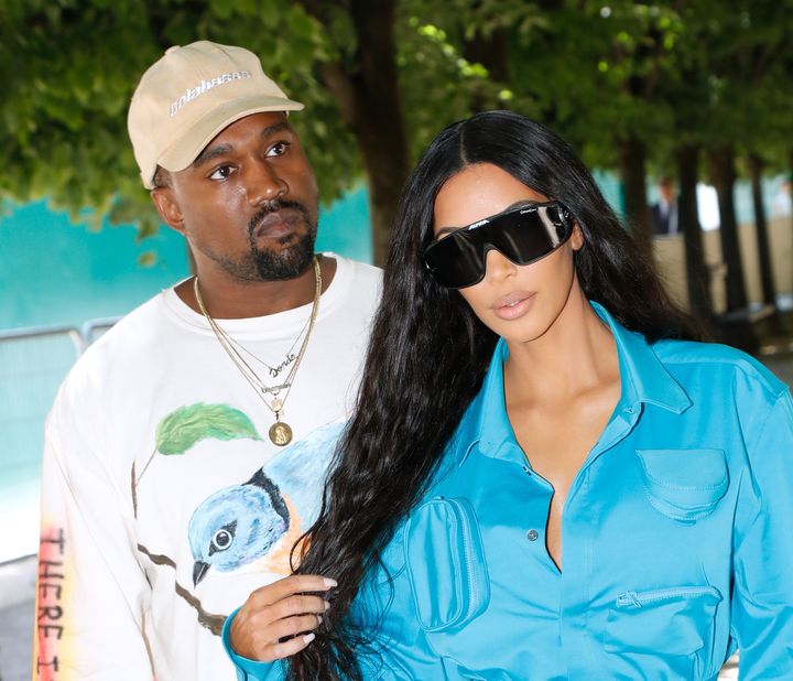 Kanye West (left) is now using Instagram to defend his wife, Kim Kardashian.