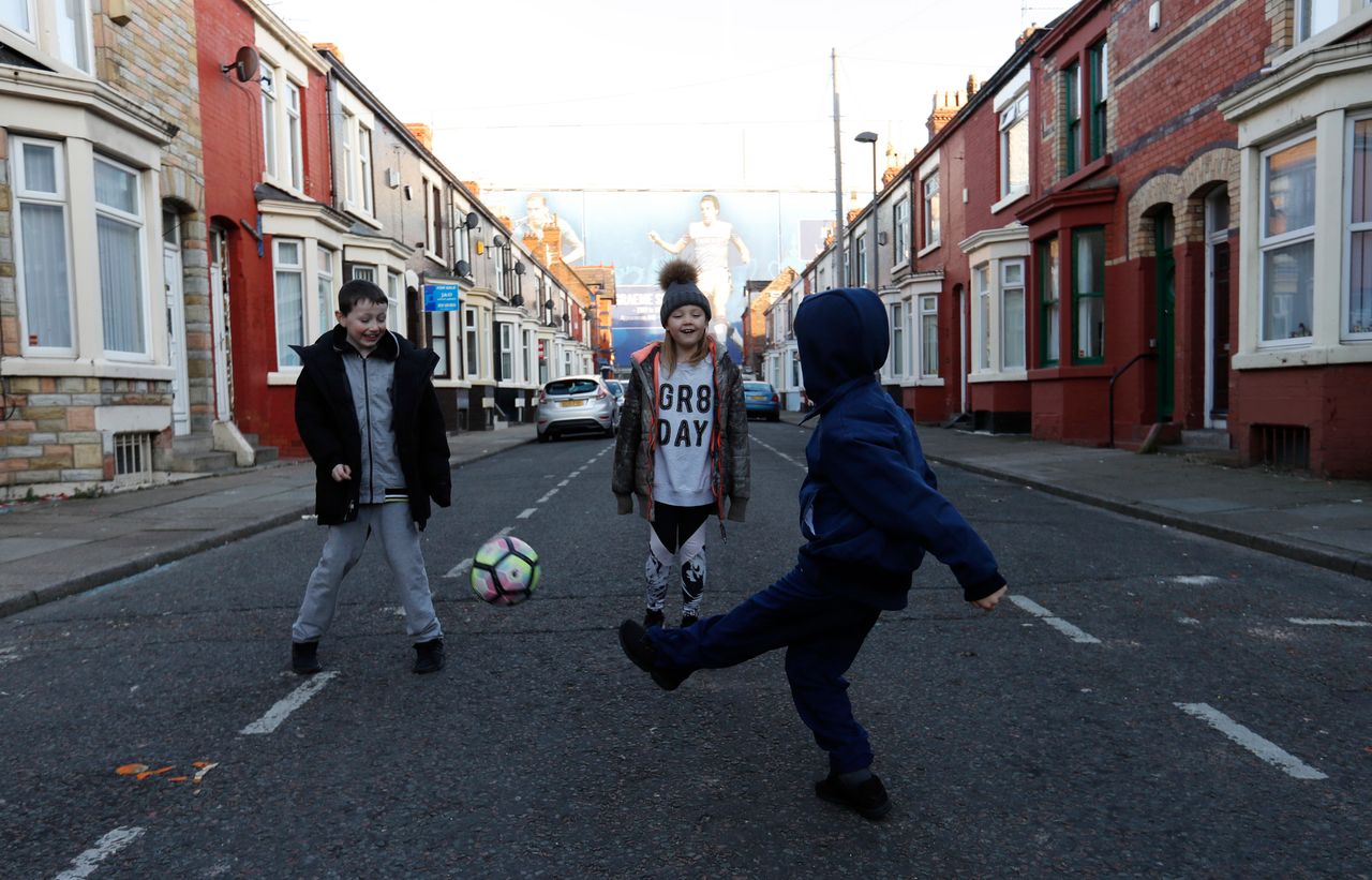 Children playing in the street near Goodison Park football stadium in Liverpool