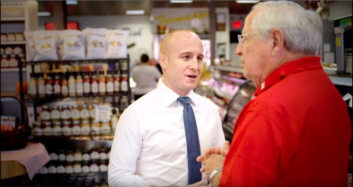 Max Rose, center, a Democrat running in New York's 11th Congressional District, is among the candidates who believe anti-corr