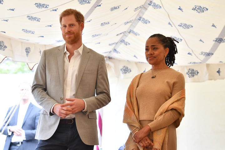Prince Harry and Doria Ragland look on as the Duchess of Sussex speaks.
