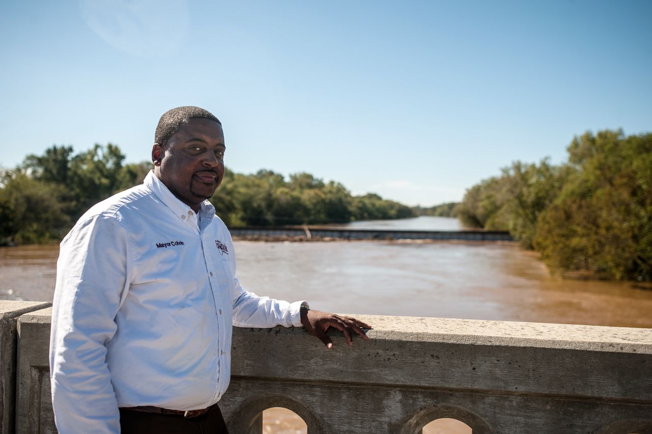 In Fayetteville, Mayor Mitch Colvin stands atop the Person Street bridge on Tuesday, which spans the Cape Fear River.