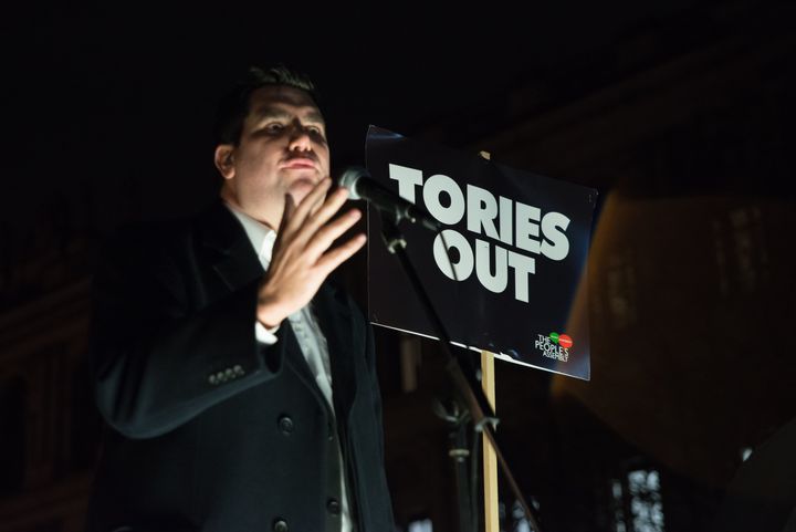 Shadow Secretary of State for Justice and Shadow Lord Chancellor, Richard Burgon, speaks against government's austerity programmes next to crates of tinned food destined for food banks
