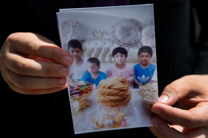 In this Aug 21 2018 photo Meripet 29 holds on to a photograph of her children in Istanbul Turkey<i></i>