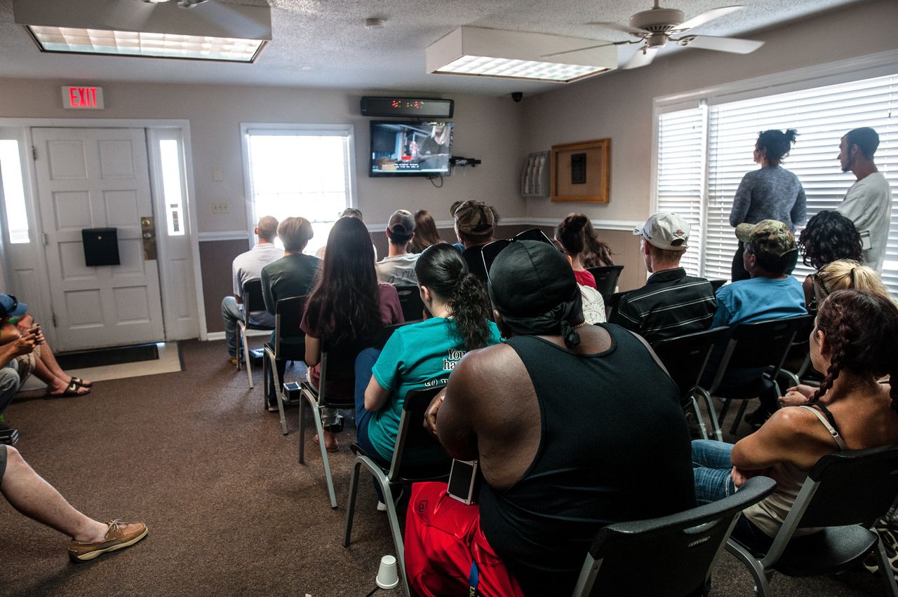 Patients watch watch TV while waiting for their number to be called to receive their medication at Carolina Treatment Center of Fayetteville.