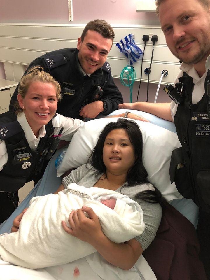 Weihong Yu and her daughter with PC Burch, PC Williams and PC King. 