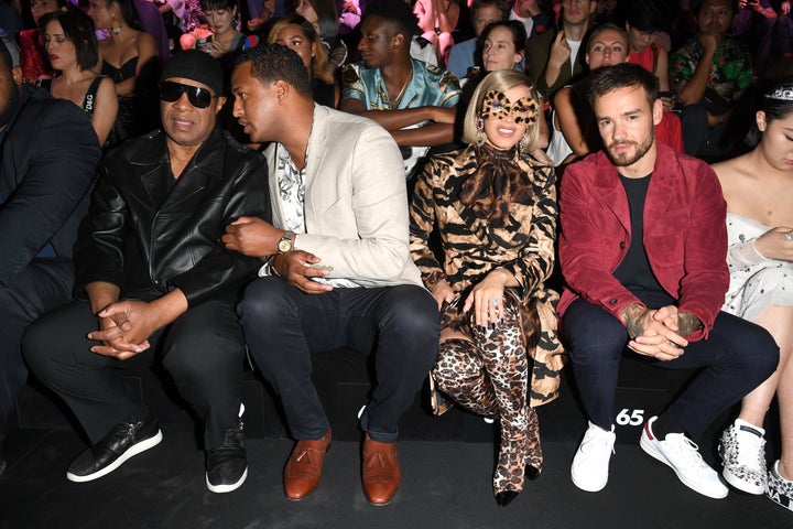 Cardi B and Liam Payne sitting next to each other at the show. 