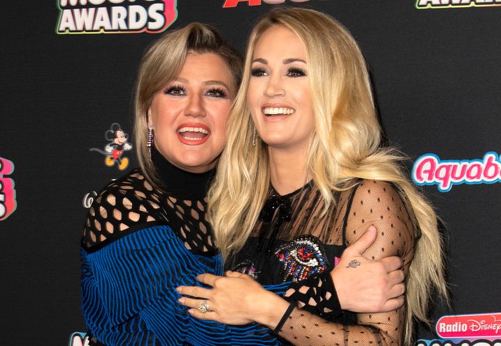 Singers/Songwriters Kelly Clarkson (L) and Carrie Underwood attend the 2018 Radio Disney Music Awards in June.