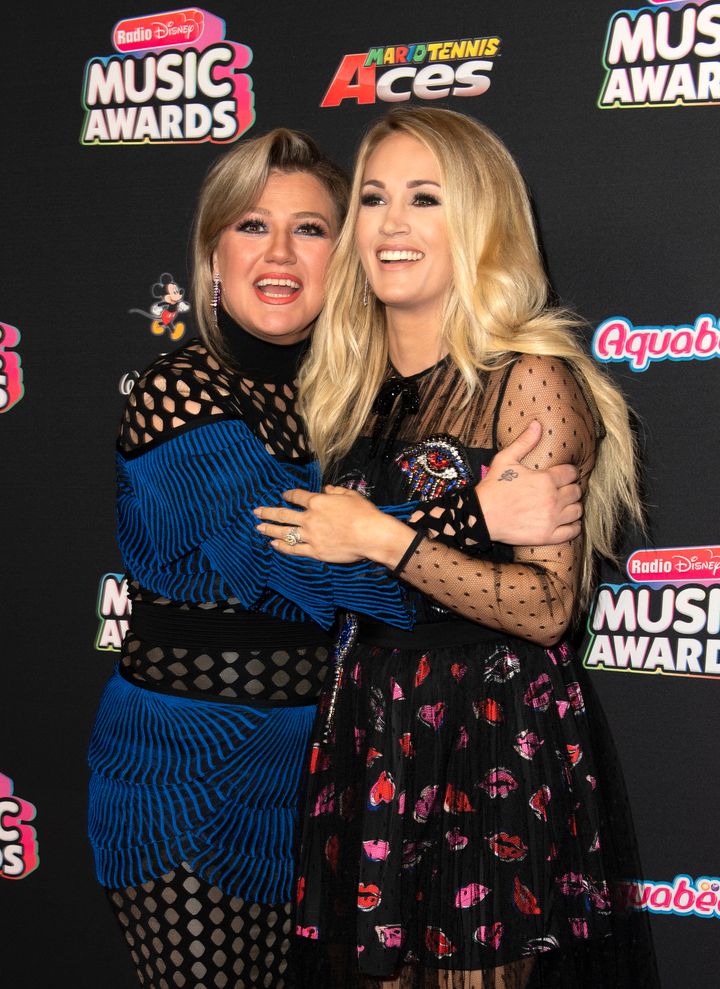 Singers/Songwriters Kelly Clarkson (L) and Carrie Underwood attend the 2018 Radio Disney Music Awards in June.