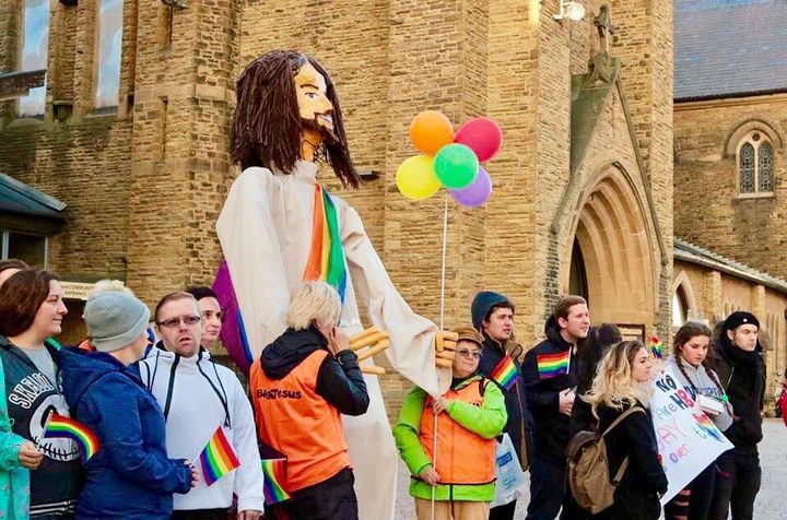 Protesters stand with a "Big Jesus" figure outside the Lancashire Festival of Hope, which took place from Sept. 21 to 23 in Blackpool, England.
