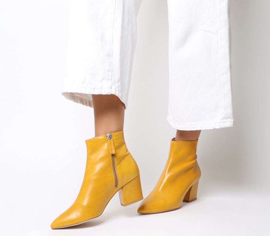 Like lilac, mustard yellow has been a key colour trend this past season. Just because the days are shorter, doesn't mean it's time to say good-bye to what's typically worn in the summertime.Aubergine Curved Heel Ankle Boots Mustard Leather, sizes 3-8 available, £89, Office.