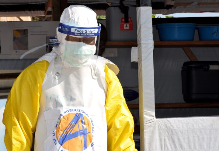 Medical worker wears protective suit as he prepares to administer Ebola care in Beni, North Kivu province 