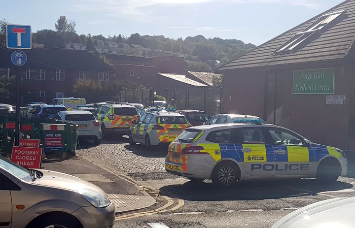 Police at the scene outside Fir Vale School in Sheffield, which had to close early following an 'incident'.