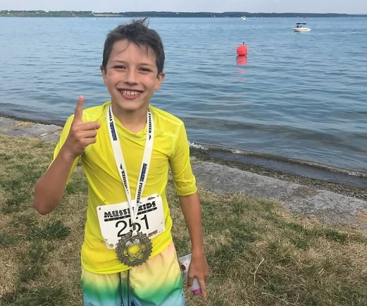 Reed just moments after winning first place in his age group in a kids' triathlon in 2018.