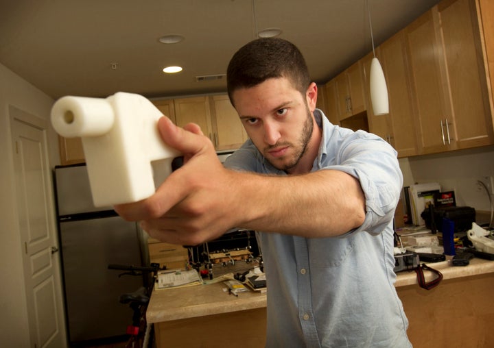 Cody Wilson shows off the first completely 3D-printed handgun, The Liberator, at his home in Austin, Texas, on May 10, 2013.