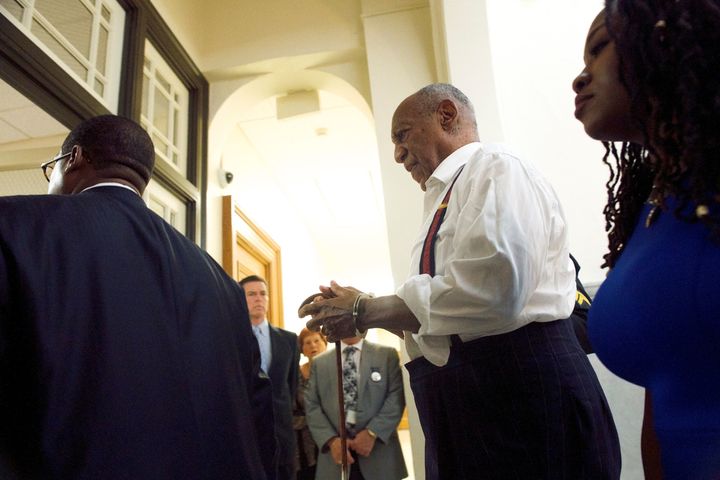 Cosby being taken into custody in handcuffs on Tuesday.