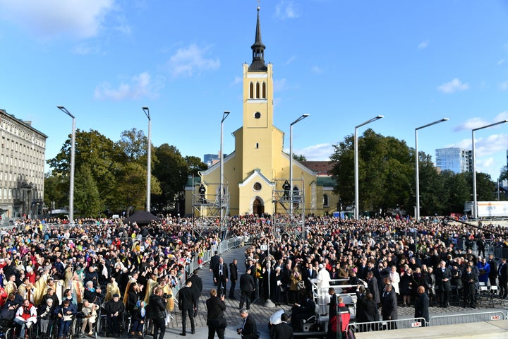 Pope Francis greets the crowd as he heads to the Freedom Square for a Mass on September 25 in Tallinn.