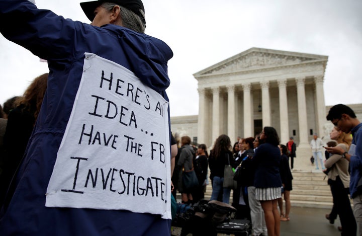 Demonstrators protest against Supreme Court nominee Brett Kavanaugh in front of the Supreme Court building in Washington on Monday.