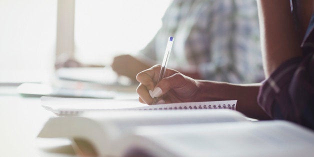 Students taking notes in adult education classroom