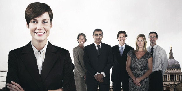 Group of businesspeople on the Millennium Bridge in front of St. Paul's Cathedral