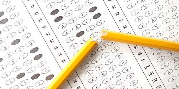 A Bubble Test Form with a pencil broken in half resting on the form.