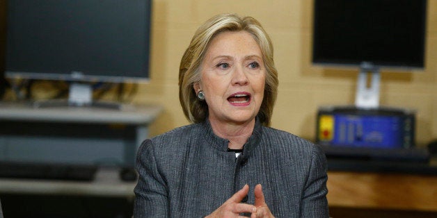 U.S. presidential candidate and former Secretary of State Hillary Clinton participates in a discussion in a classroom at New