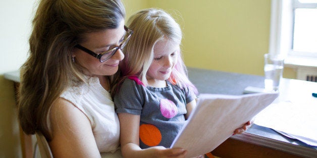 Mother reading with daughter