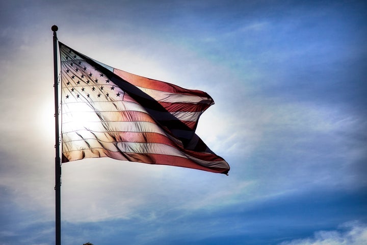 The Texas attorney general is defending a law that generally requires students to stand for the Pledge of Allegiance.