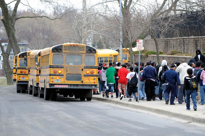 KANSAS CITY, MO - MARCH 11: Students walk in line and prepare to leave on school buses from Westport High School on March 11, 2010 in Kansas City, Missouri. The High School is among 29 in a district of 61 schools that will close due to the new budget plan that is making the cuts to ward off bankruptcy. (Photo by G. Newman Lowrance/Getty Images)