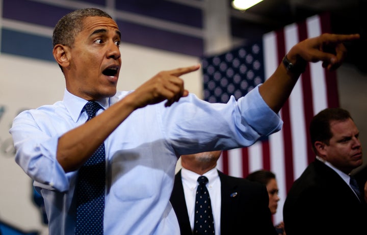 US President Barack Obama gestures as he arrives to deliver remarks during a campaign event at Canyon Springs High School in Las Vegas, Nevada, August 22, 2012. AFP PHOTO/Jim WATSON (Photo credit should read JIM WATSON/AFP/GettyImages)