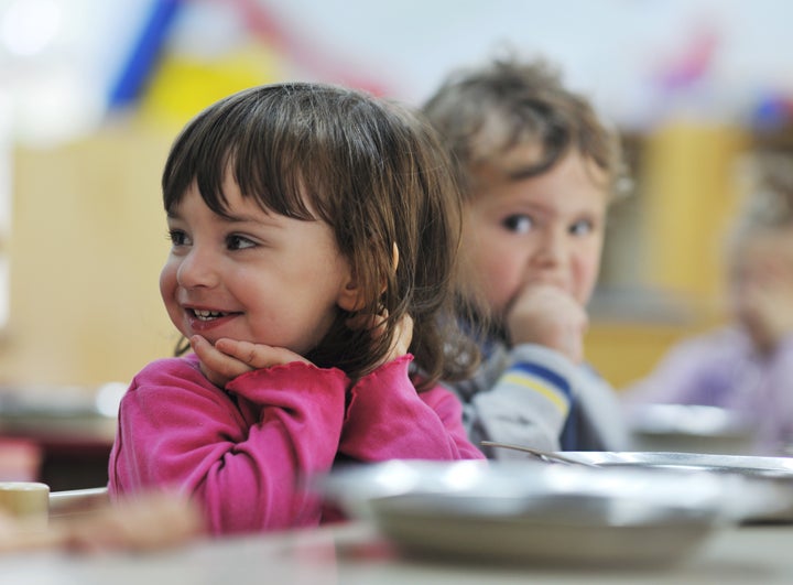 happy child kids group have fun and play at kindergarden indoor preschool education concept with teacher