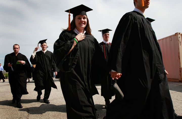 SOUTH BEND, IN - MAY 16: Notre Dame University graduates arrive for a mass at the Edmund Joyce Arena on May 16, 2009 in Sout