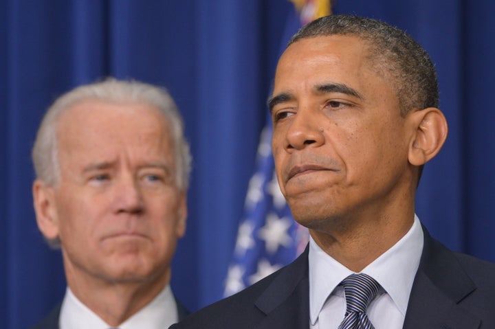 US President Barack Obama speaks on proposals to reduce gun violence as Vice President Joe Biden watches on January 16, 2013 in the South Court Auditorium of the Eisenhower Executive Office Building, next to the White House in Washington, DC. President Obama Wednesday will sign 23 executive actions to curb gun violence and demand Congress pass an assault weapons ban and other sweeping measures in response to the Newtown massacre. A senior official also said Obama would call on Congress to pass deeper measures, including bans on high-capacity magazine clips of more than 10 rounds and to prohibit armor-piercing bullets. AFP PHOTO/Mandel NGAN (Photo credit should read MANDEL NGAN/AFP/Getty Images)