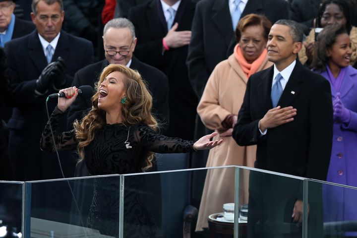 WASHINGTON, DC - JANUARY 21: Beyoncé performs the national anthem as U.S. President Barack Obama looks on during the presidential inauguration on the West Front of the U.S. Capitol January 21, 2013 in Washington, DC. Barack Obama was re-elected for a second term as President of the United States. (Photo by Alex Wong/Getty Images)