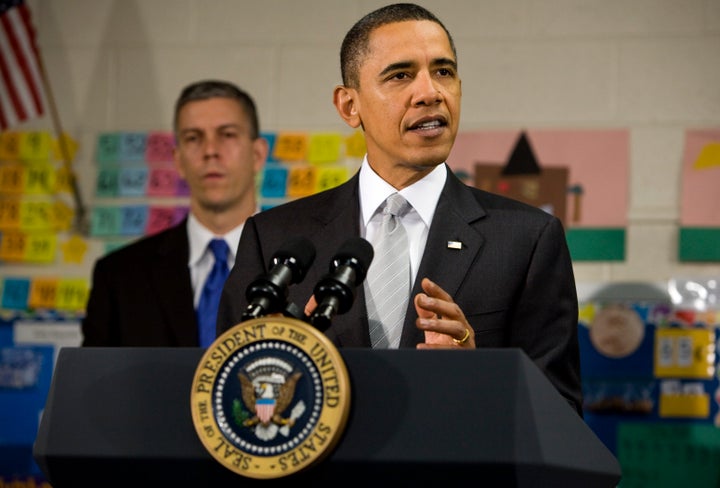 FALLS CHURCH, VA - JANUARY 19: (AFP OUT) U.S. President Barack Obama delivers remarks on the 'Race To The Top' program at the Graham Road Elementary School January 19, 2010 in Falls Church, Virginia.The President is announcing his request for an additional $1.35 billion in 2011 for the program that was created as part of the economic stimulus bill signed into law last year. He is joined by Secretary of Education Arne Duncan. (Photo by Kristoffer Tripplaar-Pool/Getty Images)