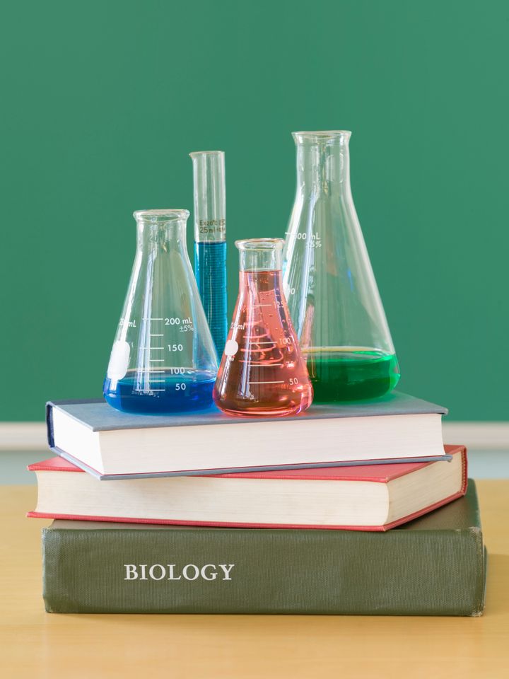 Chemistry beakers and stack of books