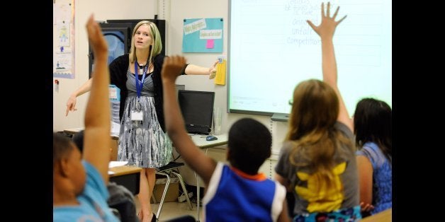 In this Oct. 1, 2013, file photo, Amy Lawson, a fifth-grade teacher at Silver Lake Elementary School in Middletown, Del., tea