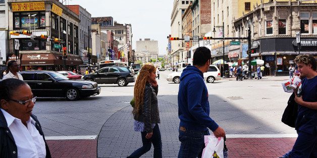 NEWARK, NJ - MAY 13: People walk down a street in downtown on May 13, 2014 in Newark, New Jersey. Voters in New Jersey's largest city go to the polls on May 13, to choose a new mayor following Democrat Cory Booker's departure to the U.S. Senate. Newark, which is approximately 12 miles from New York City, is struggling with a rise in violent crime and unemployment. Shavar Jeffries, 39, and Ras Baraka, 44, are the two democrats running for the job in the heavily Democratic city. (Photo by Spencer Platt/Getty Images)