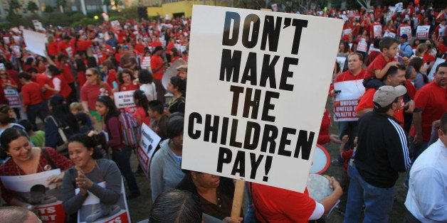 LOS ANGELES, CA - JANUARY 29: United Teachers Los Angeles and supporters protest state and local budget cuts on January 29, 2009 in Los Angeles, California. District officials say they are facing a gaping $500 million budget shortfall. The board of education earlier this month authorized nearly 2,300 layoffs, but the superintendent ruled midyear layoffs out. (Photo by David McNew/Getty Images)