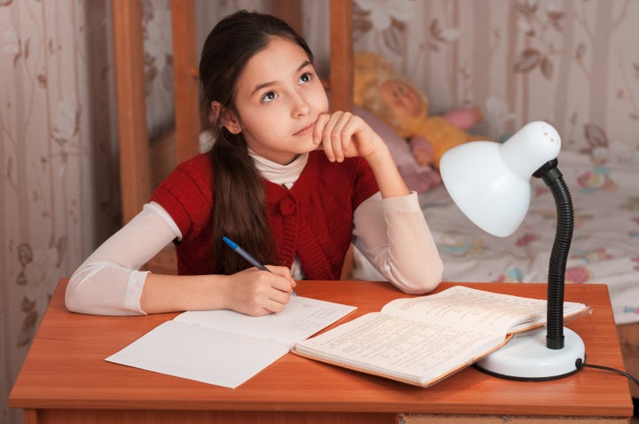 thoughtful cute girl doing...