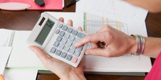 Woman using calculator