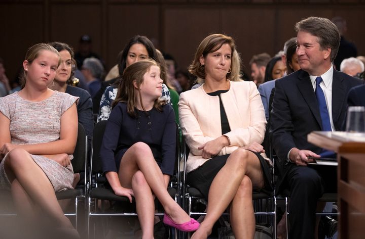 Judge Brett Kavanaugh, right, smiles at his daughter, Liza, second left, as his daughter Margaret, right and wife, Ashley, right center.