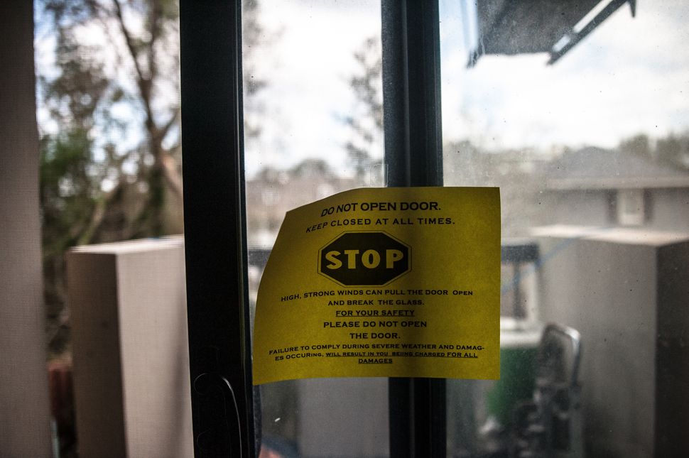 The Wilmington Housing Authority placed warning signs on residents' glass doors before Hurricane Florence struck.