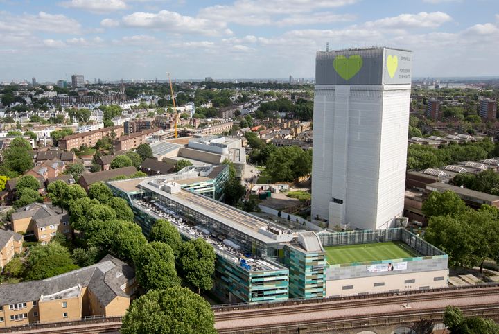 Grenfell Tower was later covered in plastic sheeting.