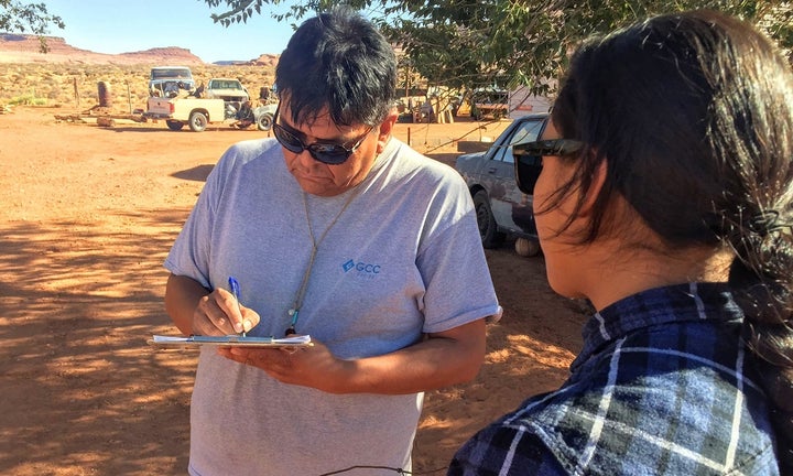 Delaney After Buffalo, right, registers Leonard Holiday to vote in Oljato, Utah. Many Native Americans face extreme barriers