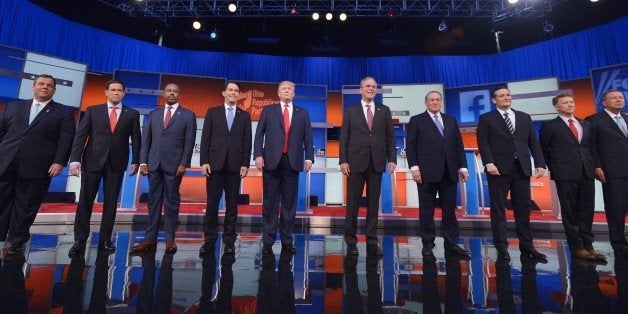 Republican presidential candidates arrive on stage for the Republican presidential debate on August 6, 2015 at the Quicken Loans Arena in Cleveland, Ohio. From left are: New Jersey Gov. Chris Christie; Florida Sen. Marco Rubio; retired neurosurgeon Ben Carson; Wisconsin Gov. Scott Walker; real estate magnate Donald Trump; former Florida Gov. Jeb Bush; former Arkansas Gov. Mike Huckabee; Texas Sen. Ted Cruz; Kentucky Sen. Rand Paul; and Ohio Gov. John Kasich. AFP PHOTO / MANDEL NGAN (Photo credit should read MANDEL NGAN/AFP/Getty Images)