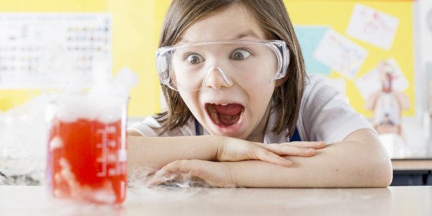 Schoolgirl (11-13) doing science experiment in school laboratory, Scientific Experiment,Safety,BeakerBrown Hair,Caucasian,Appearance,Chemistry,Chemistry Class,Liquid,Measuring, Laboratory, smoking, dry ice,Safety Glasses,chmistry,excitement