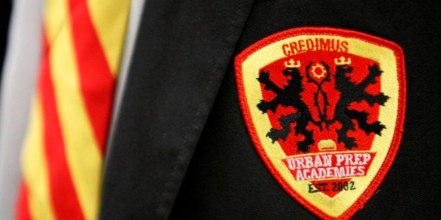 In this photo taken Tuesday, June 1, 2010 is the crest of the Urban Prep High School in Chicago. The crest is topped with the Latin motto-Credimus meaning We Believe, and the striped tie is only worn by seniors accepted to college. (AP Photo/Charles Rex Arbogast)