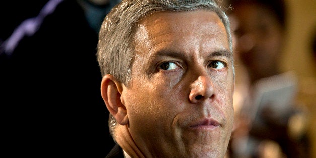 Education Secretary Arne Duncan listens as President Barack Obama speaks about education during a lunch meeting with teachers, Monday, July 7, 2014, in the Blue Room of the White House in Washington. The nation's largest teachers' union wants Duncan to quit. Delegates of the National Education Association adopted a business item July 4 at its annual convention in Denver that called for his resignation. The vote underscores the long standing tension between the Obama administration and teachers' unions _ historically a steadfast Democratic ally. (AP Photo/Jacquelyn Martin)