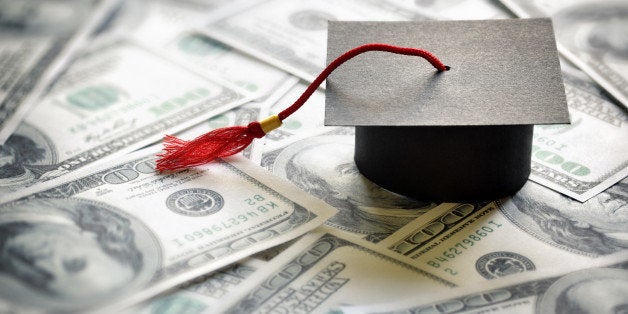 Graduation mortar board cap on one hundred dollar bills concept for the cost of a college and university education